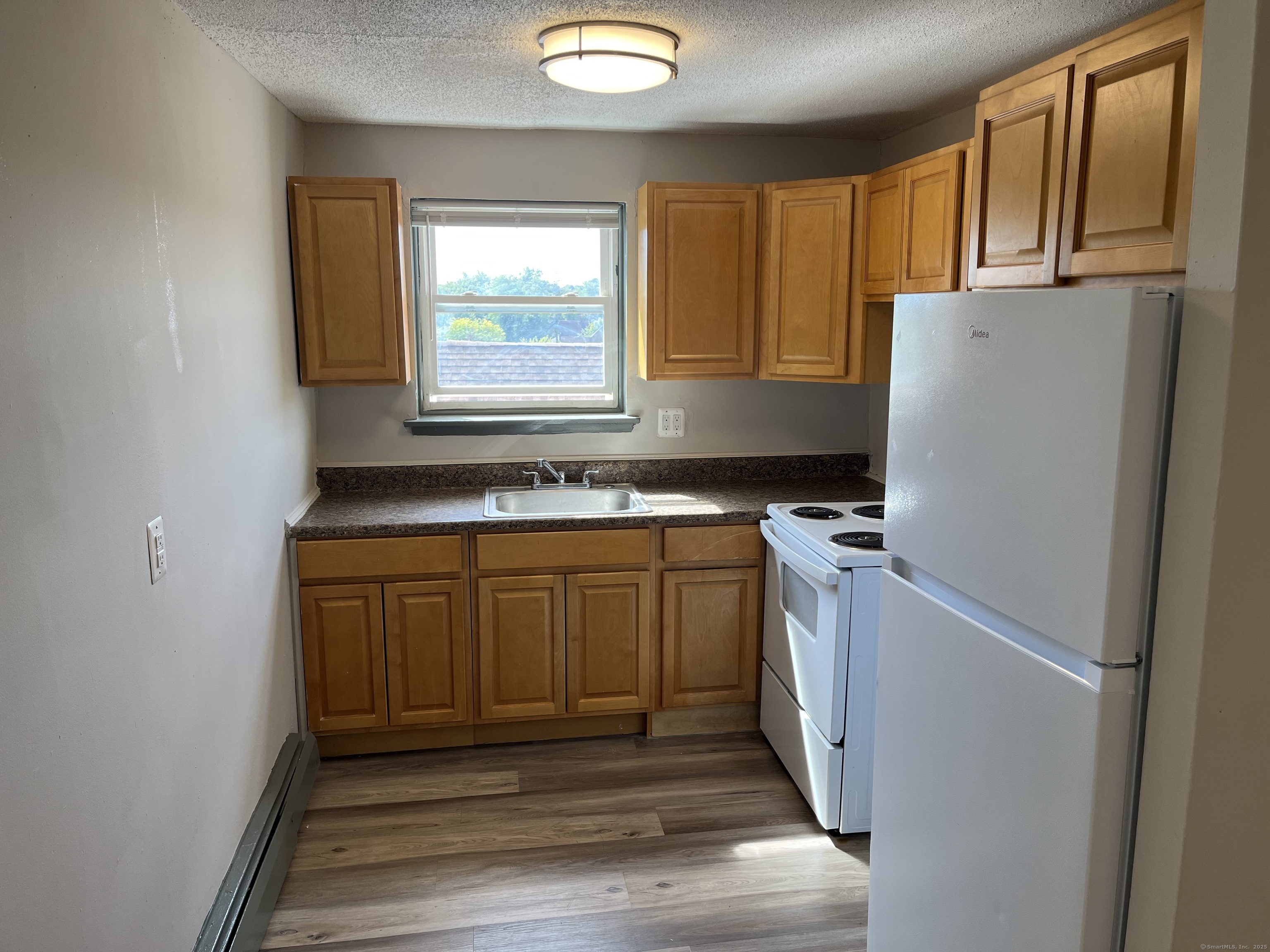 32 Cook Avenue, Unit D23 Meriden, CT 06451 - Photo 2 of 12 a utility room with window washer and dryer