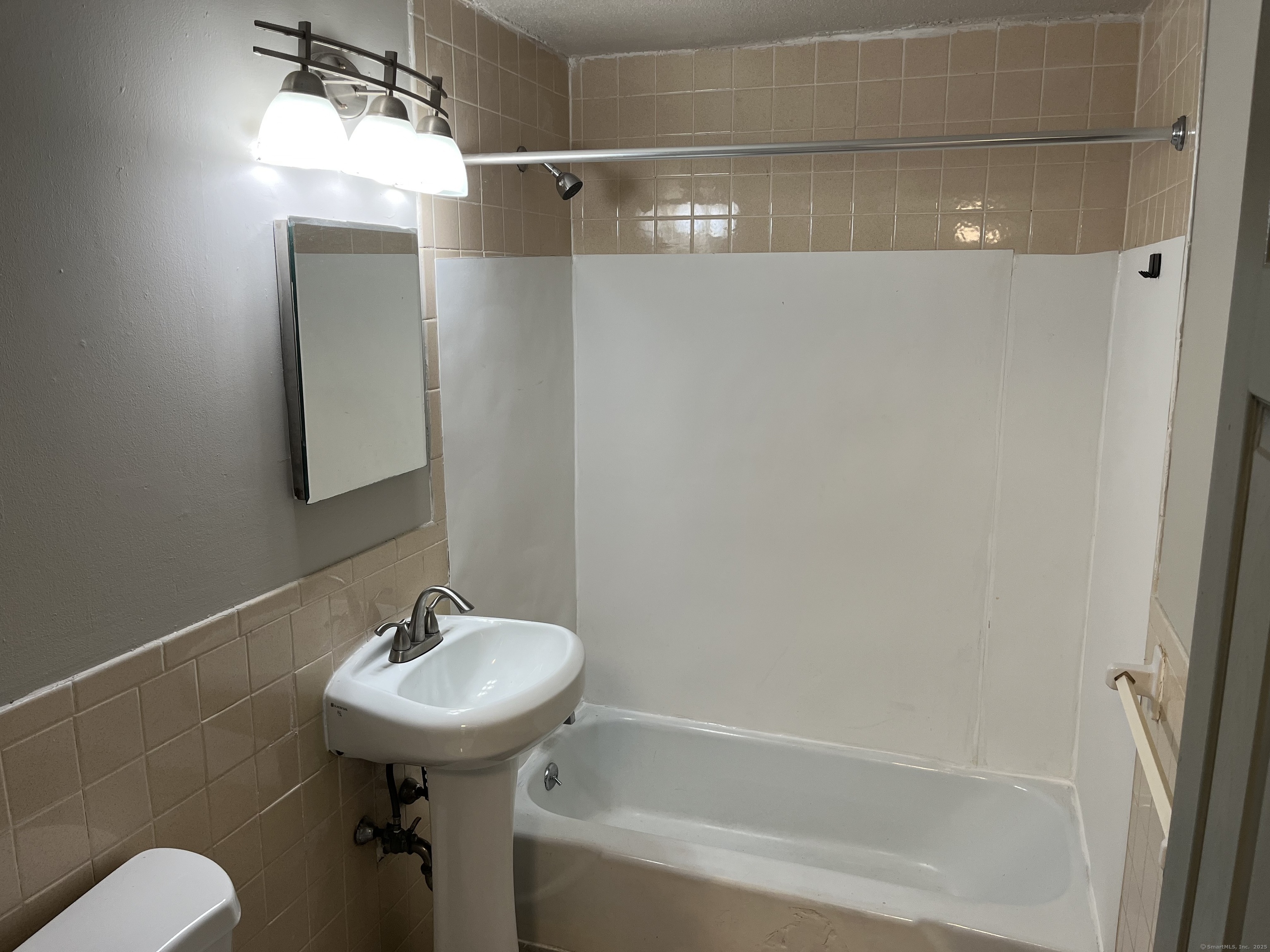 32 Cook Avenue, Unit D23 Meriden, CT 06451 - Photo 7 of 12 a bathroom with a sink toilet and shower