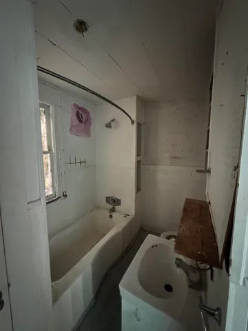 a view of an empty room with a window