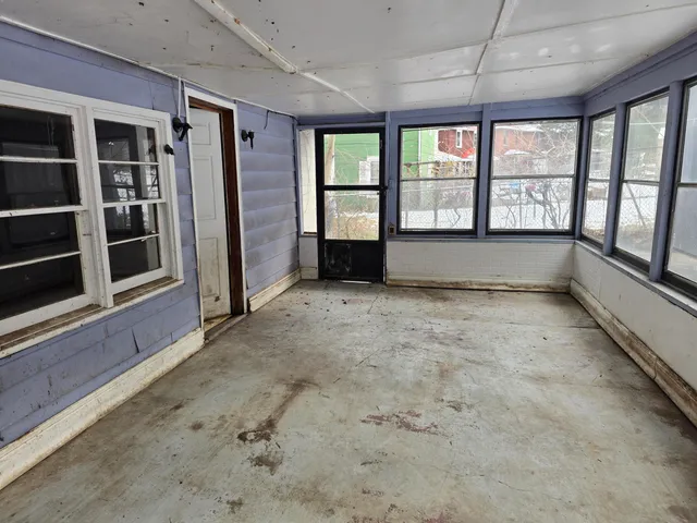 a view of a house with a window and wooden floor