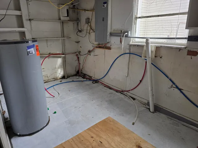 a backyard of a house with a yard covered with snow in front of house