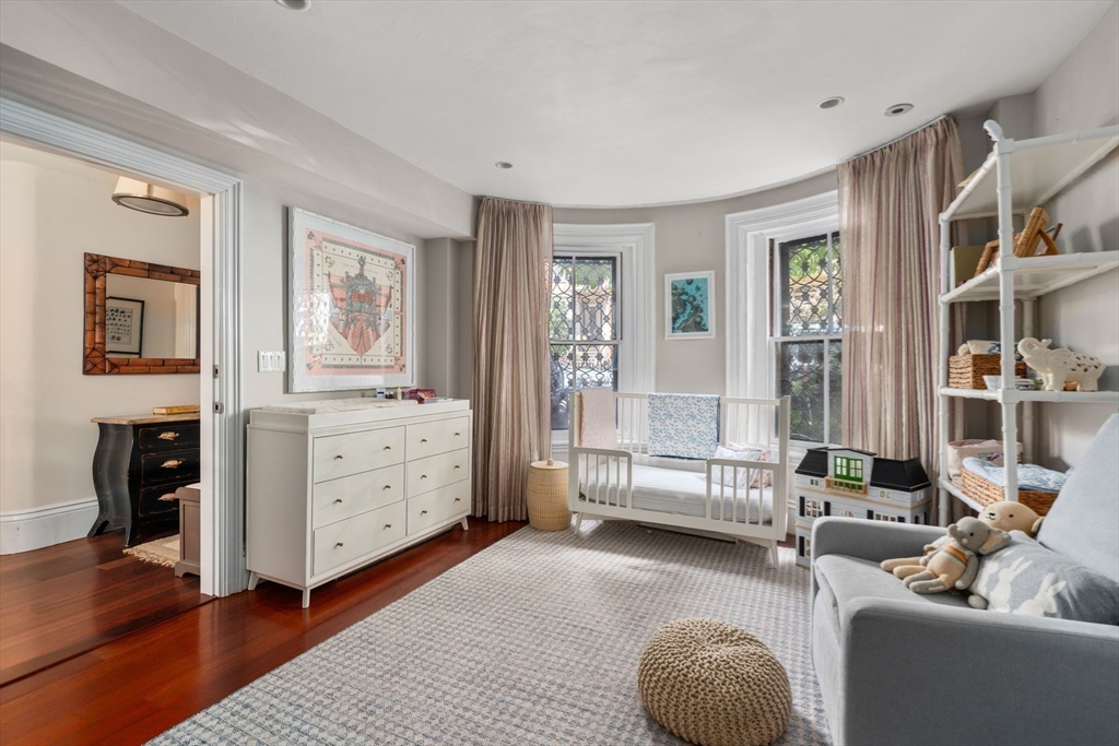 32 Rutland Square, Unit 1 Boston, MA 02118 - Photo 12 of 24 a bedroom with furniture and a window