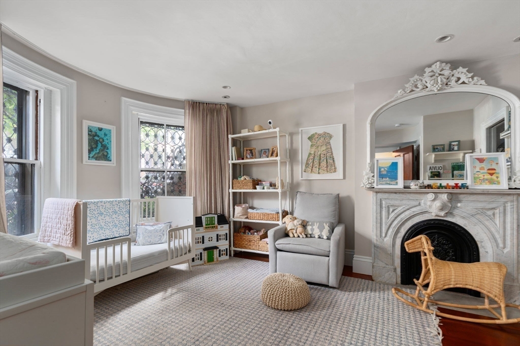 32 Rutland Square, Unit 1 Boston, MA 02118 - Photo 13 of 24 a living room with furniture and a fireplace