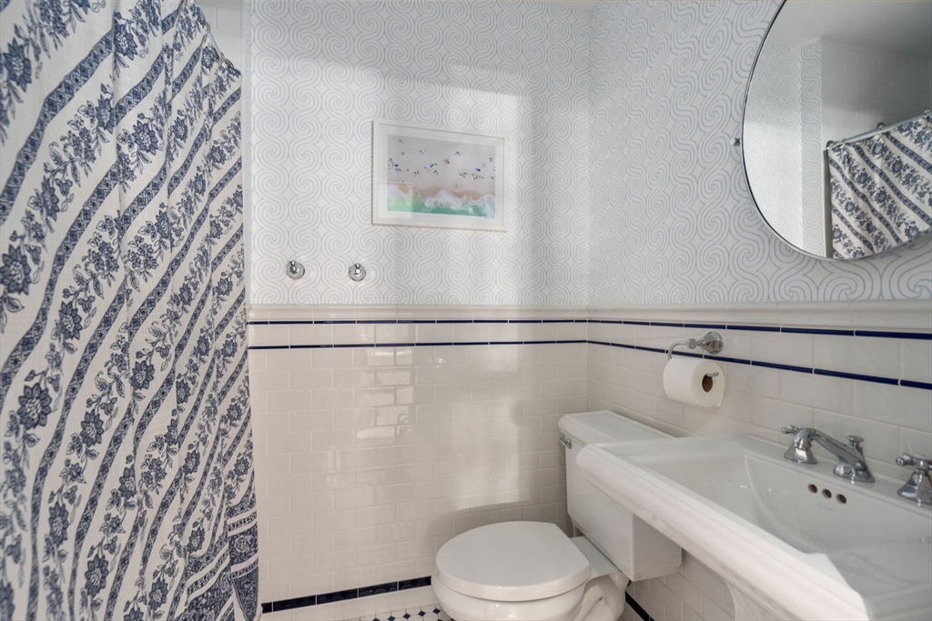 32 Rutland Square, Unit 1 Boston, MA 02118 - Photo 14 of 24 a white toilet sitting next to a bathroom sink