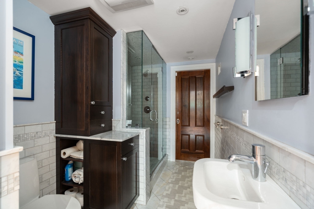 32 Rutland Square, Unit 1 Boston, MA 02118 - Photo 17 of 24 a bathroom with a sink vanity and a mirror