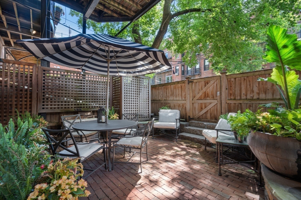 32 Rutland Square, Unit 1 Boston, MA 02118 - Photo 18 of 24 a patio with a table and chairs