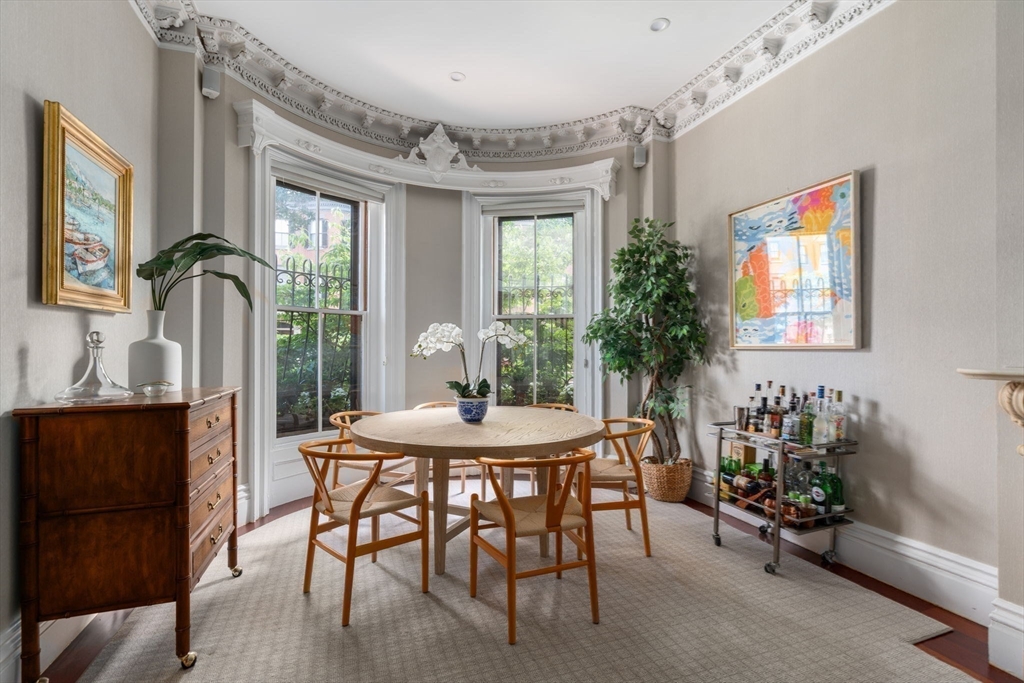 32 Rutland Square, Unit 1 Boston, MA 02118 - Photo 7 of 24 a view of a dining room with furniture window and outside view