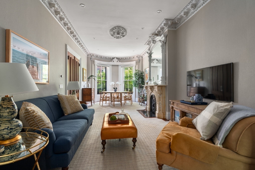 32 Rutland Square, Unit 1 Boston, MA 02118 - Photo 8 of 24 a living room with furniture and a flat screen tv