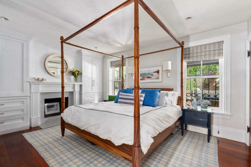 32 Rutland Square, Unit 1 Boston, MA 02118 - Photo 9 of 24 a bedroom with a bed a table and painting