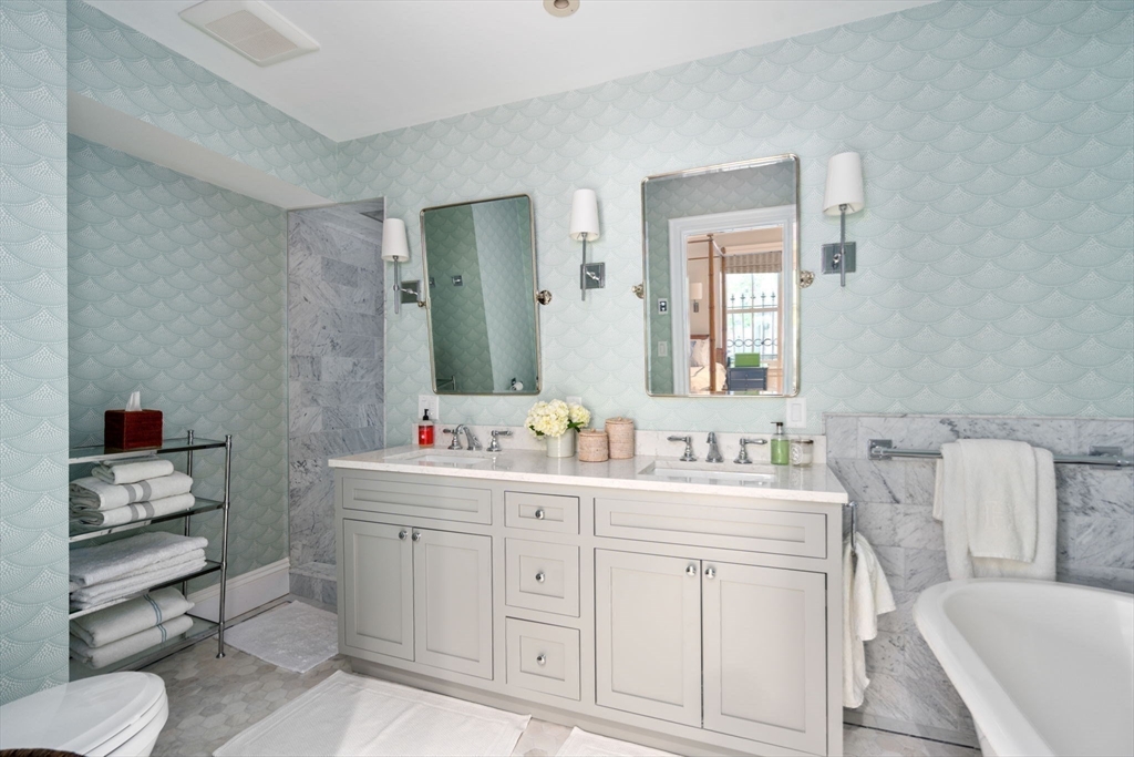 32 Rutland Square, Unit 1 Boston, MA 02118 - Photo 10 of 24 a bathroom with a toilet sink and mirror