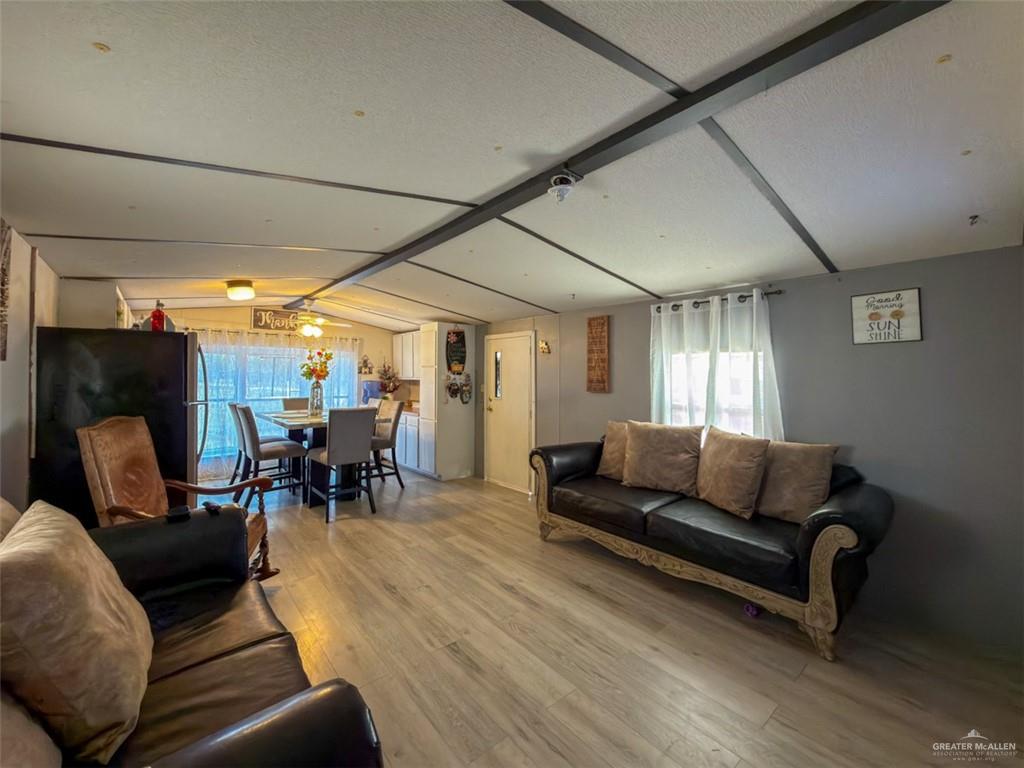 39817 Mile 4 Road Penitas, TX 78576 - Photo 3 of 19 a living room with furniture and a large window