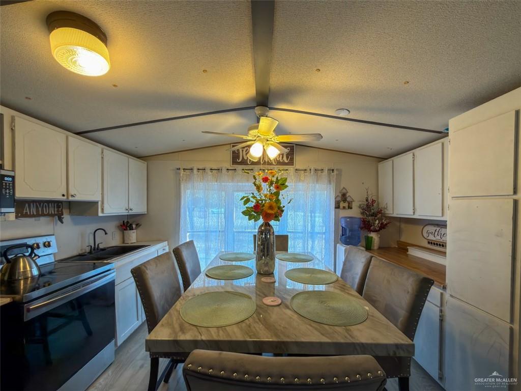 39817 Mile 4 Road Penitas, TX 78576 - Photo 5 of 19 a view of a dining room with furniture