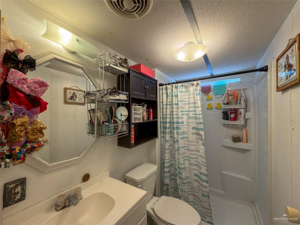 39817 Mile 4 Road Penitas, TX 78576 - Photo 8 of 19 a bathroom with a sink toilet and shower
