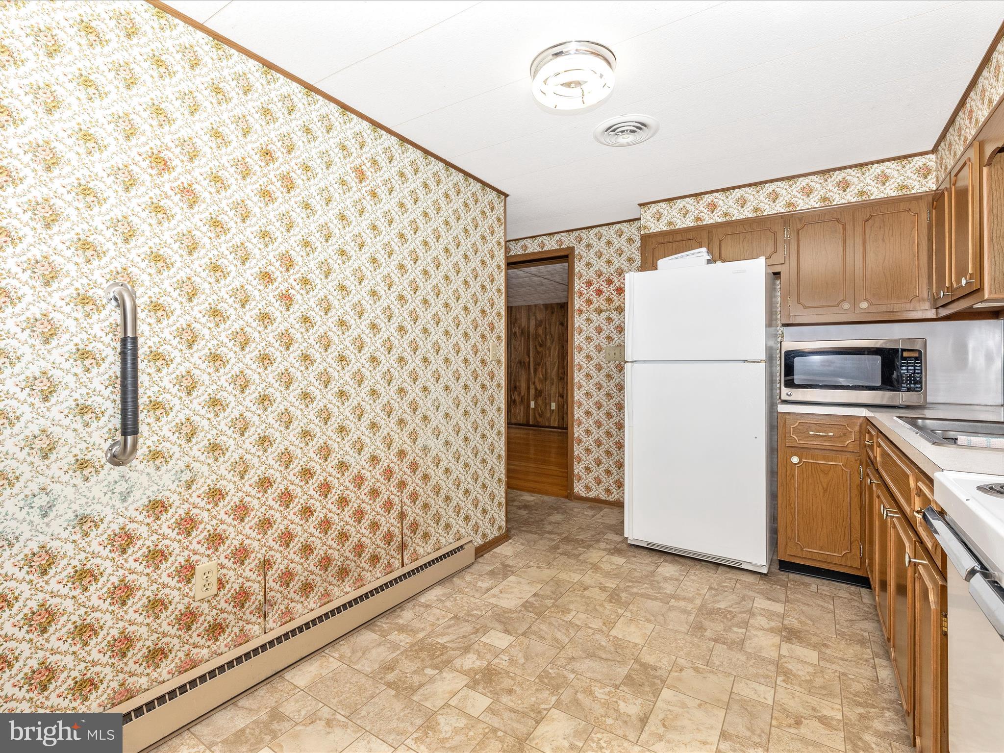 6 Schaller Lane Smithsburg, MD 21783 - Photo 16 of 61 a kitchen with a refrigerator and a stove