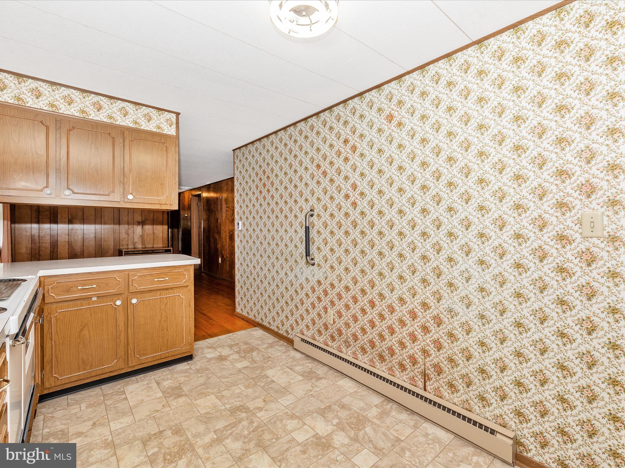 6 Schaller Lane Smithsburg, MD 21783 - Photo 17 of 61 a kitchen with granite countertop white cabinets and stainless steel appliances