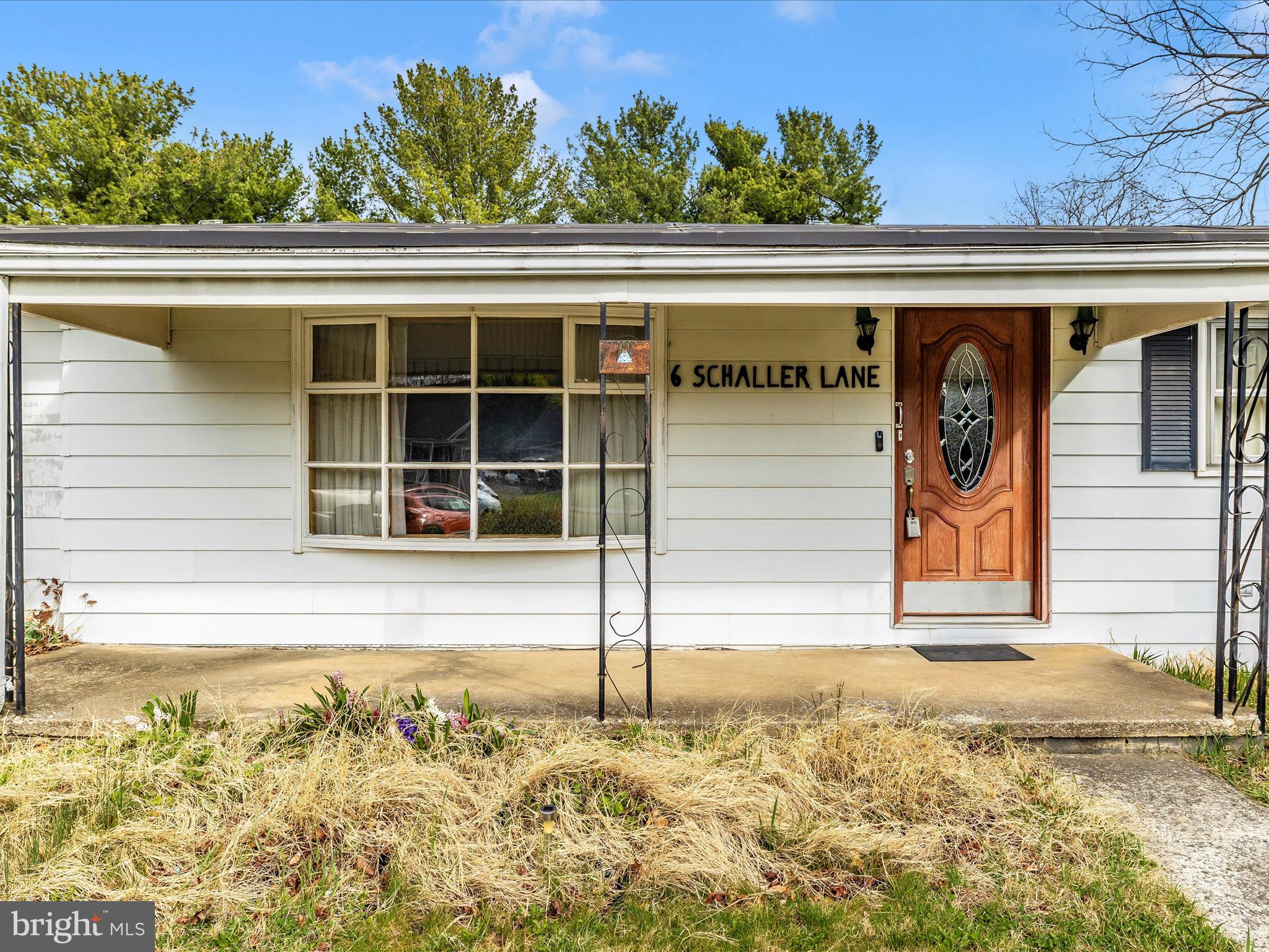 6 Schaller Lane Smithsburg, MD 21783 - Photo 2 of 61 a front view of a house with a garden