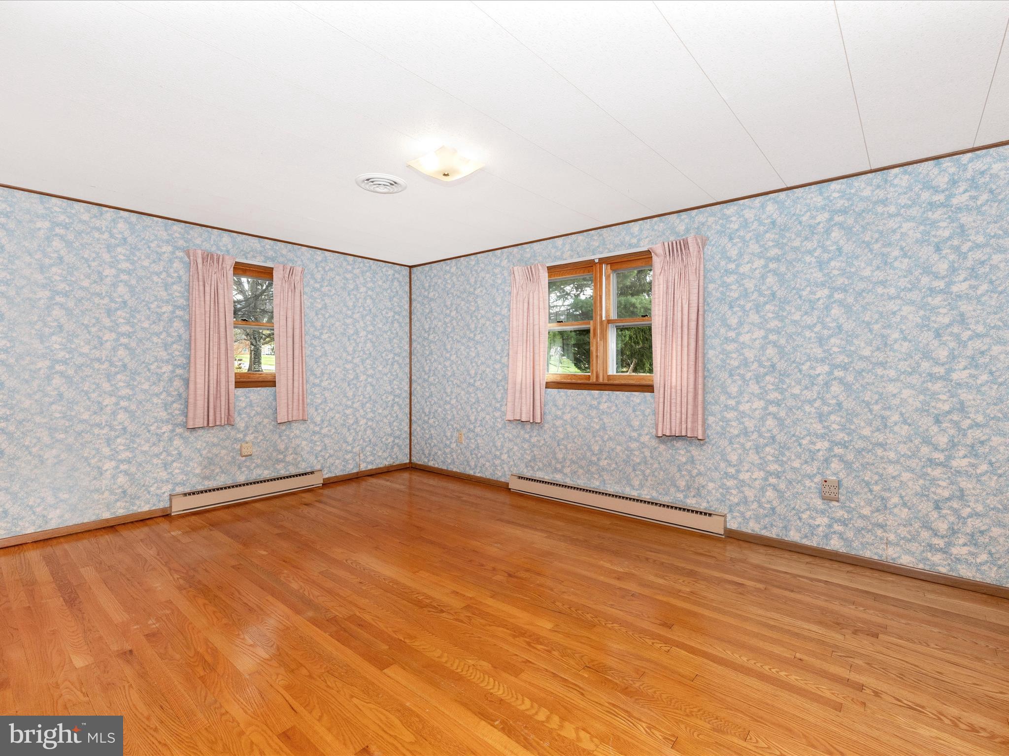 6 Schaller Lane Smithsburg, MD 21783 - Photo 24 of 61 a view of an empty room with wooden floor and a window