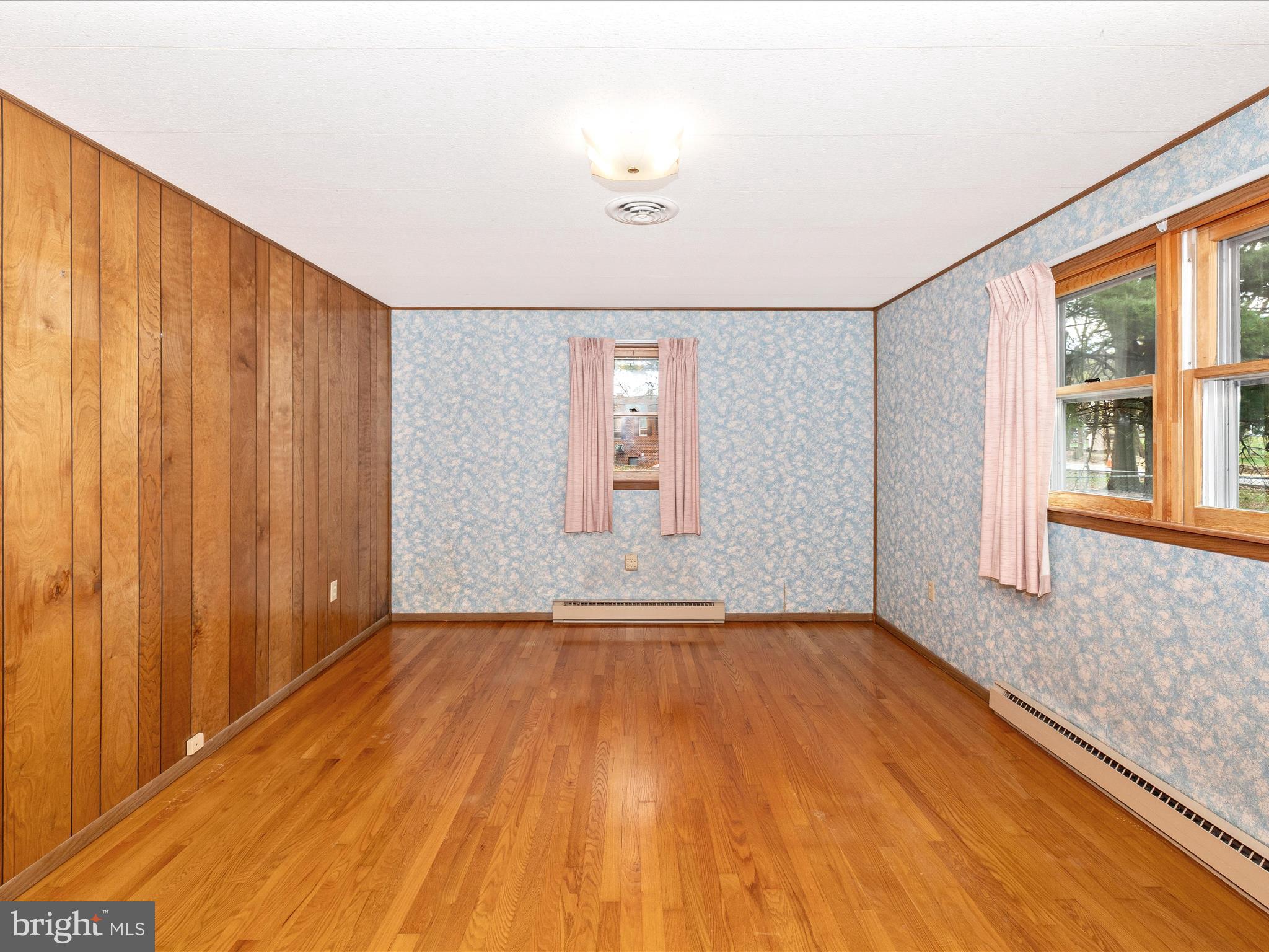 6 Schaller Lane Smithsburg, MD 21783 - Photo 25 of 61 a view of an empty room with glass door and wooden floor