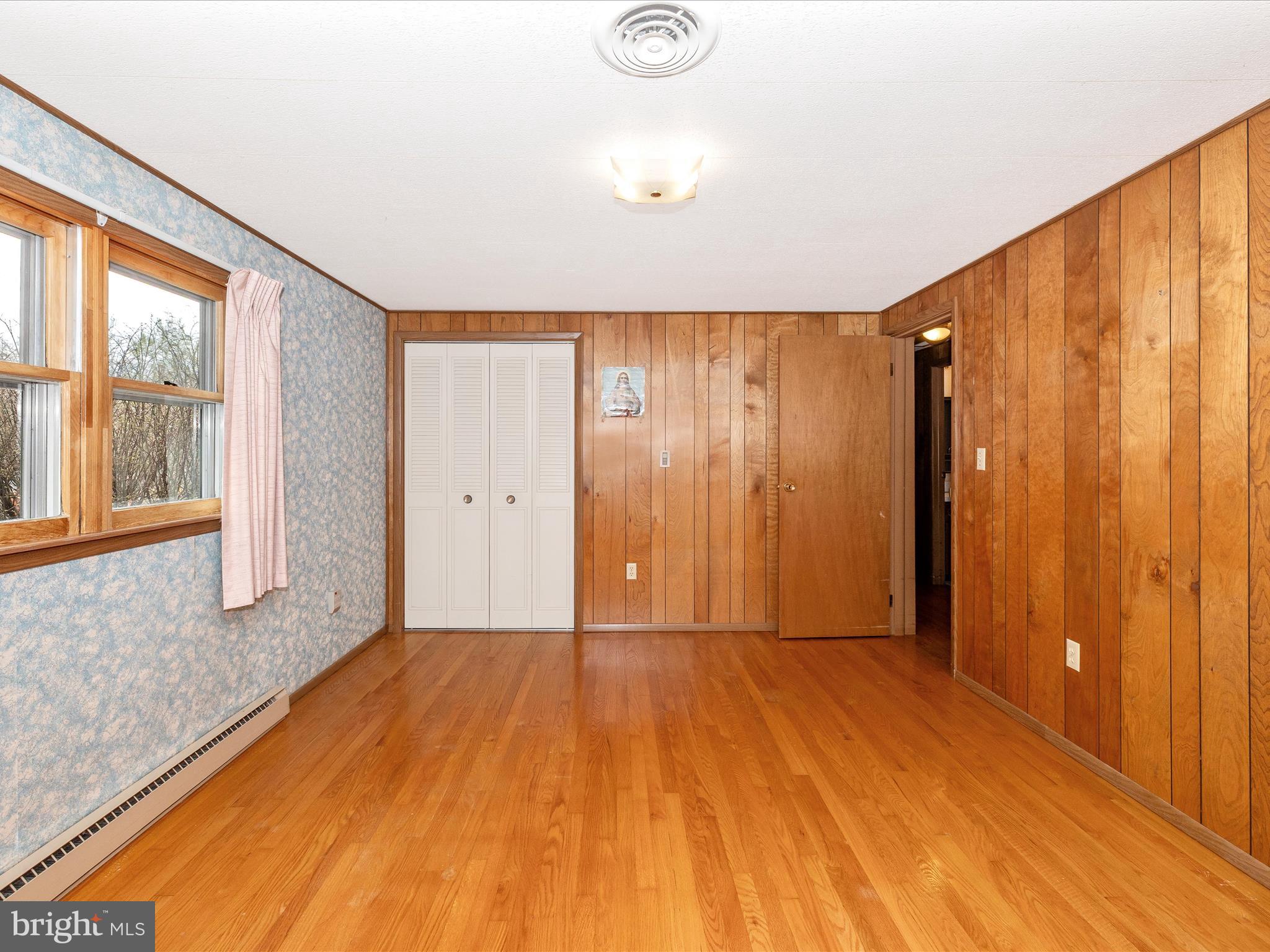 6 Schaller Lane Smithsburg, MD 21783 - Photo 28 of 61 a view of an empty room with wooden floor and a window