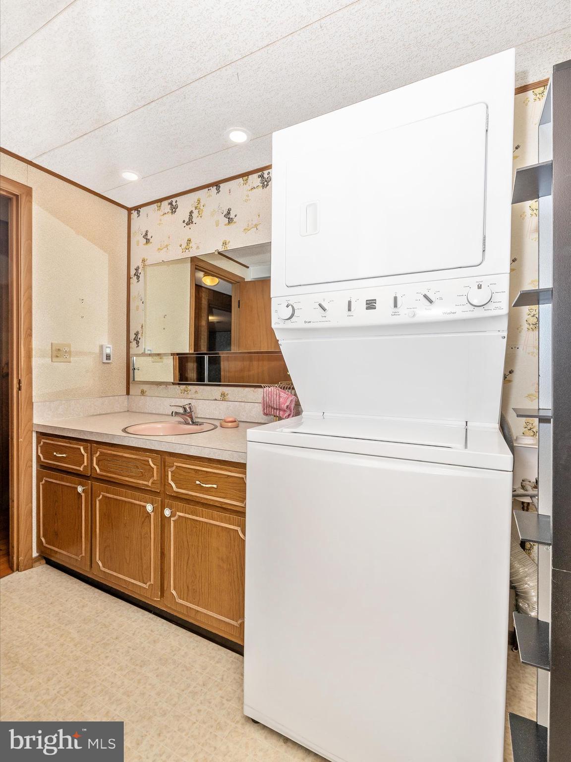 6 Schaller Lane Smithsburg, MD 21783 - Photo 37 of 61 a view of washer and dryer with kitchen in the background