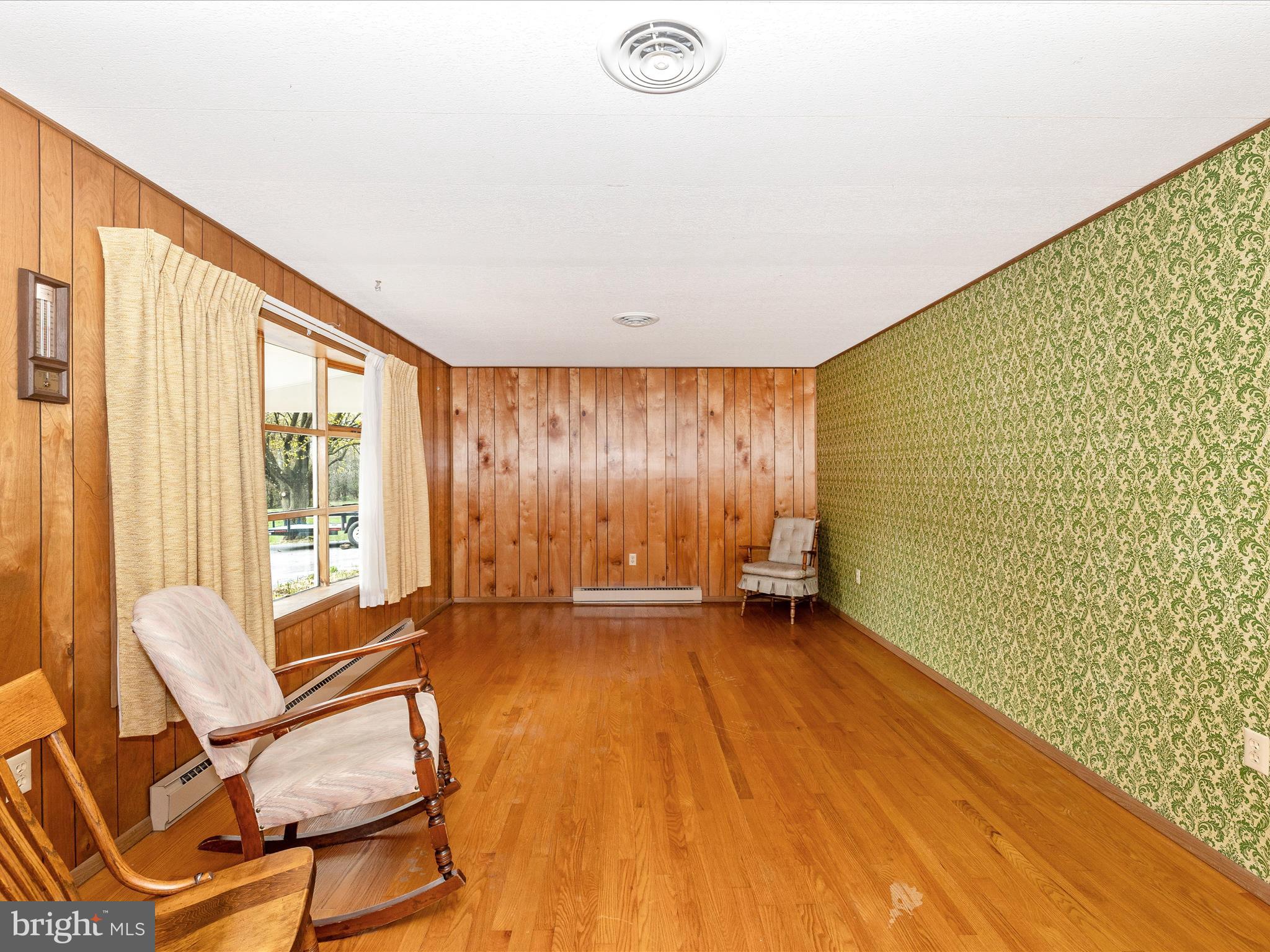 6 Schaller Lane Smithsburg, MD 21783 - Photo 5 of 61 a view of an empty room with a window and wooden floor