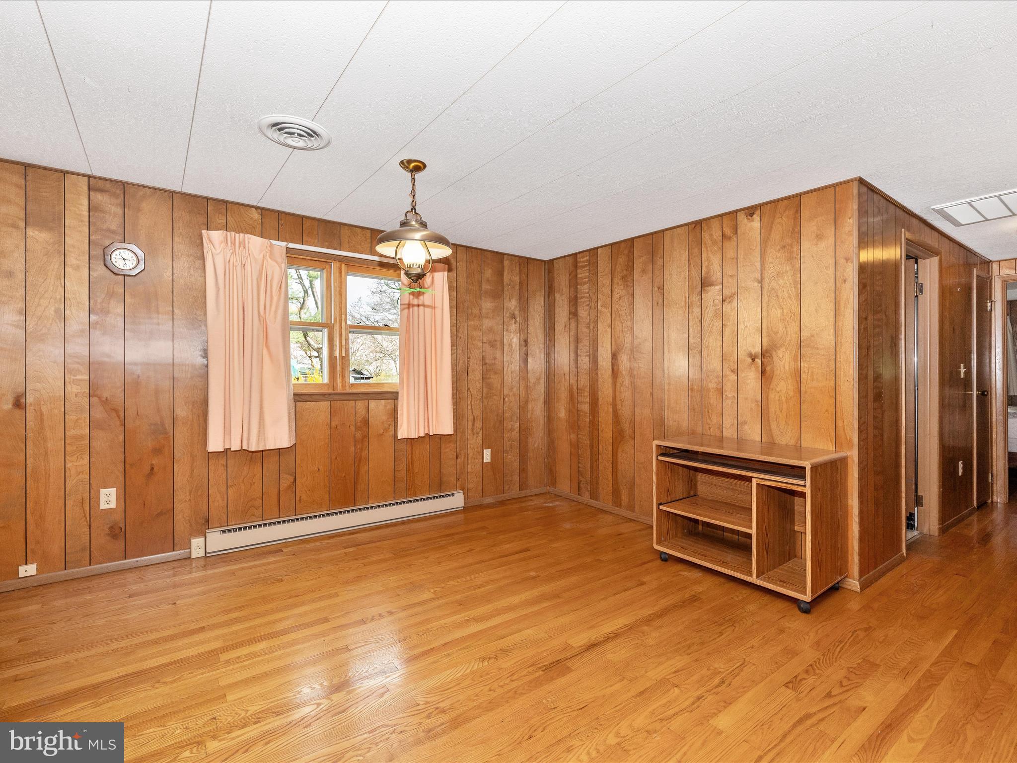6 Schaller Lane Smithsburg, MD 21783 - Photo 9 of 61 a view of a livingroom with wooden floor and windows