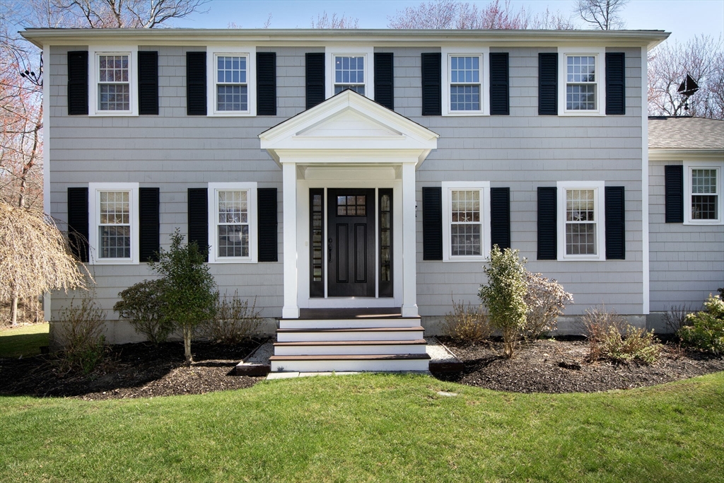 18 Longmeadow Road Scituate, MA 02066 - Photo 2 of 37 a front view of a house with a yard and garage