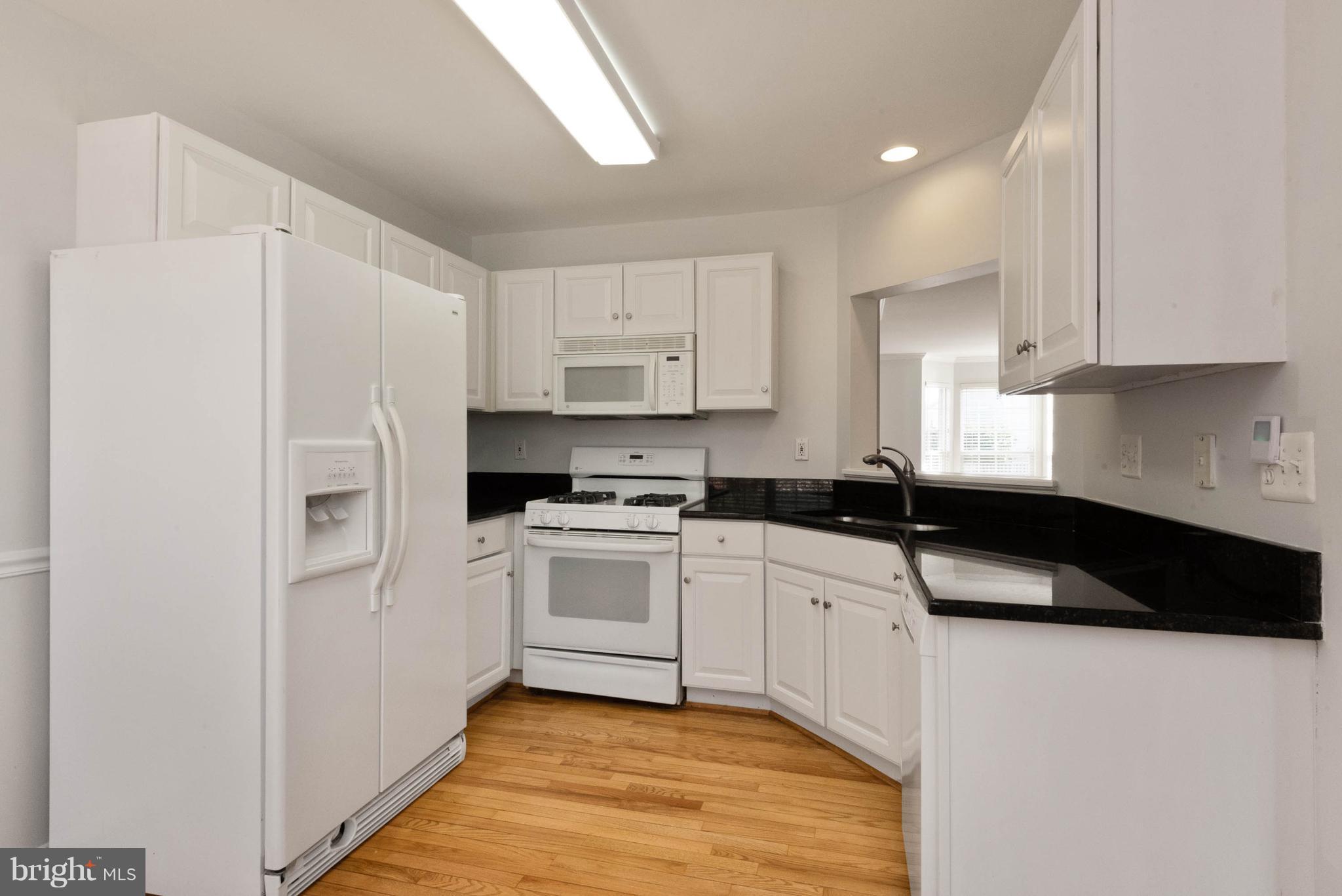 745 Howards Loop Annapolis, MD 21401 - Photo 13 of 33 HDWD flooring in Kitchen