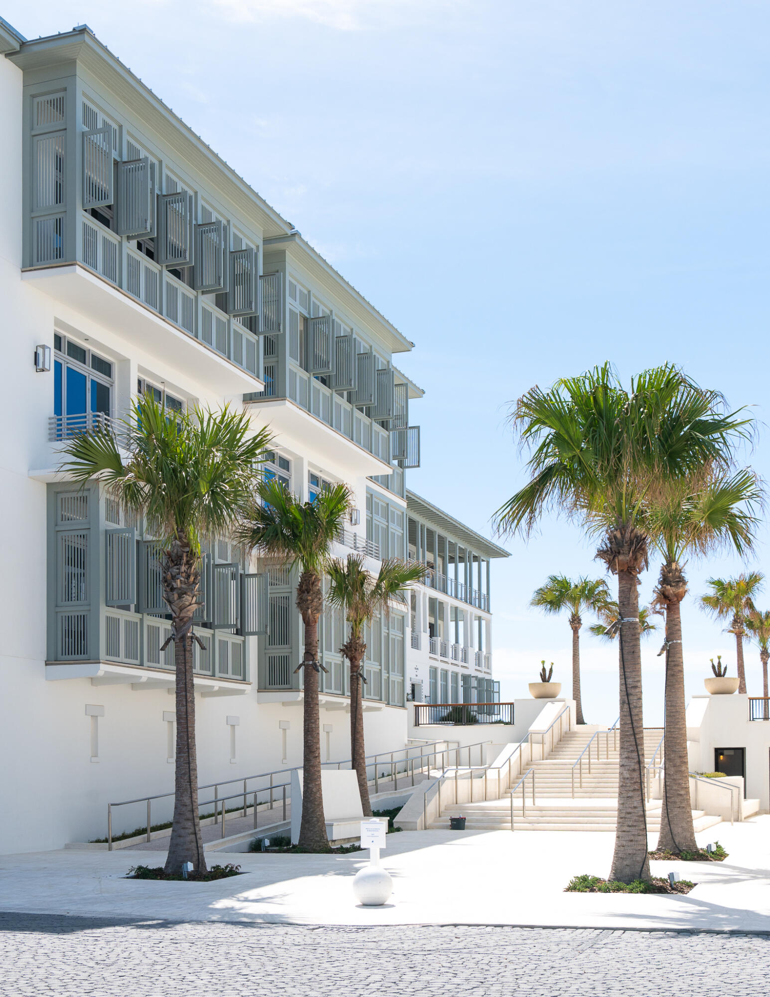 290 Sea Garden St Inlet Beach, Unit 201 Inlet Beach, FL 32461 - Photo 5 of 49 a front view of a building with a garden