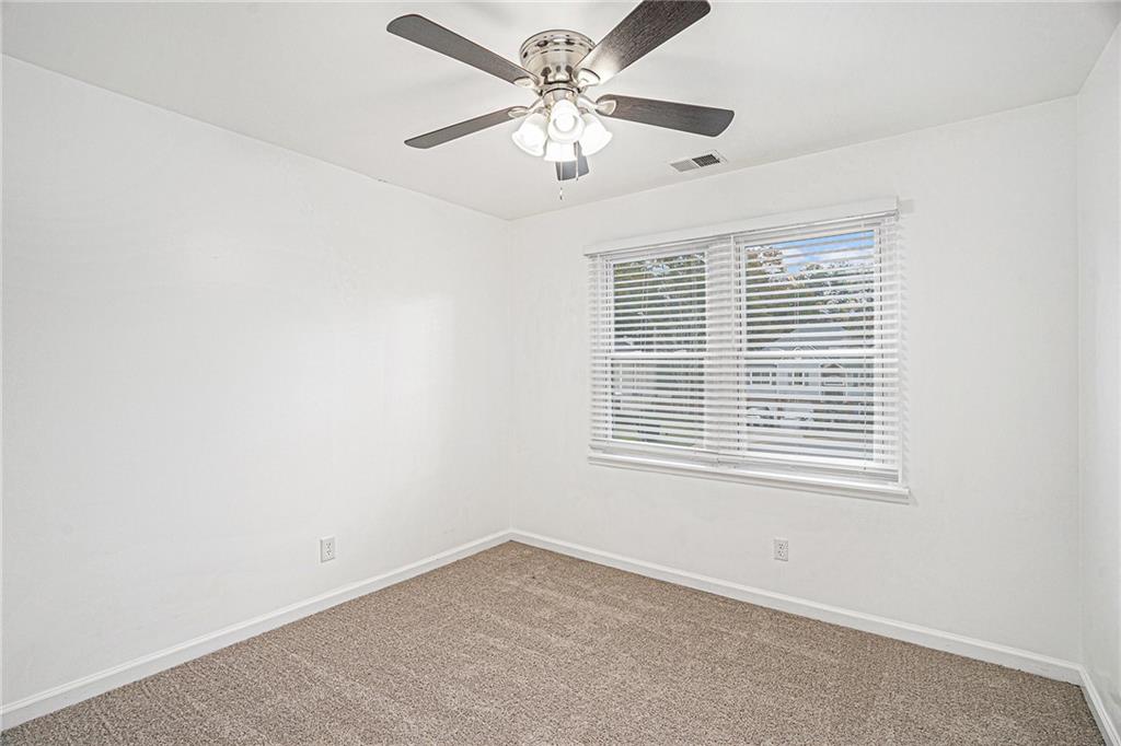 4208 Mistymorn Point Powder Springs, GA 30127 - Photo 15 of 28 an empty room with a window and a fan