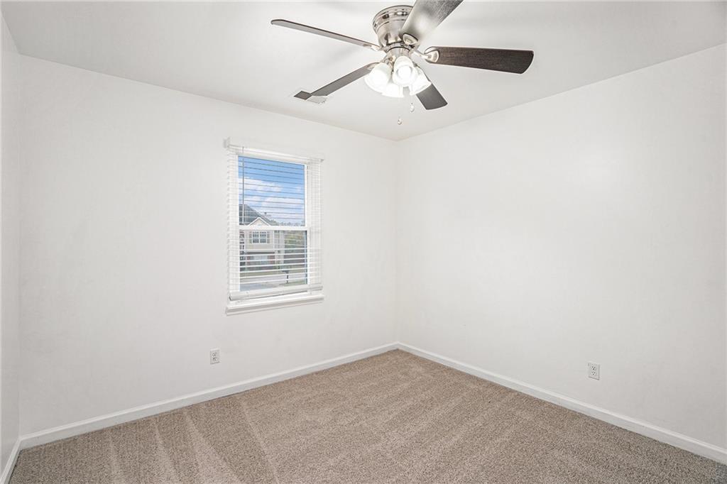 4208 Mistymorn Point Powder Springs, GA 30127 - Photo 17 of 28 an empty room with a window and a fan