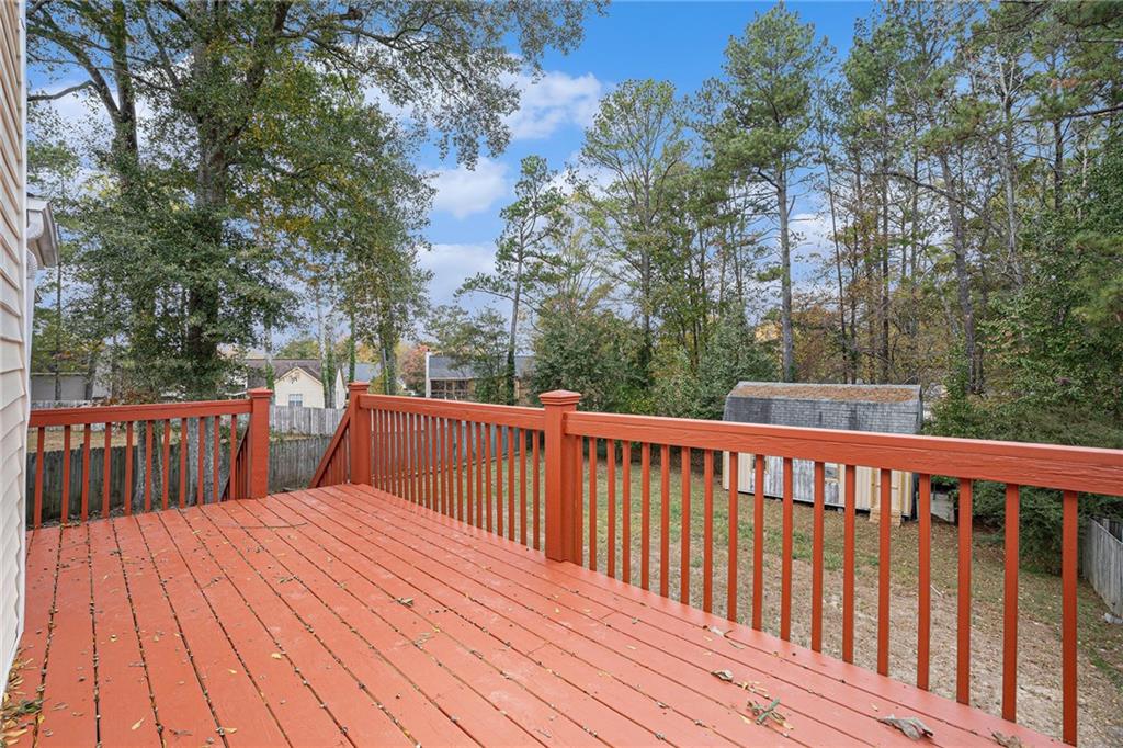 4208 Mistymorn Point Powder Springs, GA 30127 - Photo 25 of 28 a balcony with wooden floor and fence
