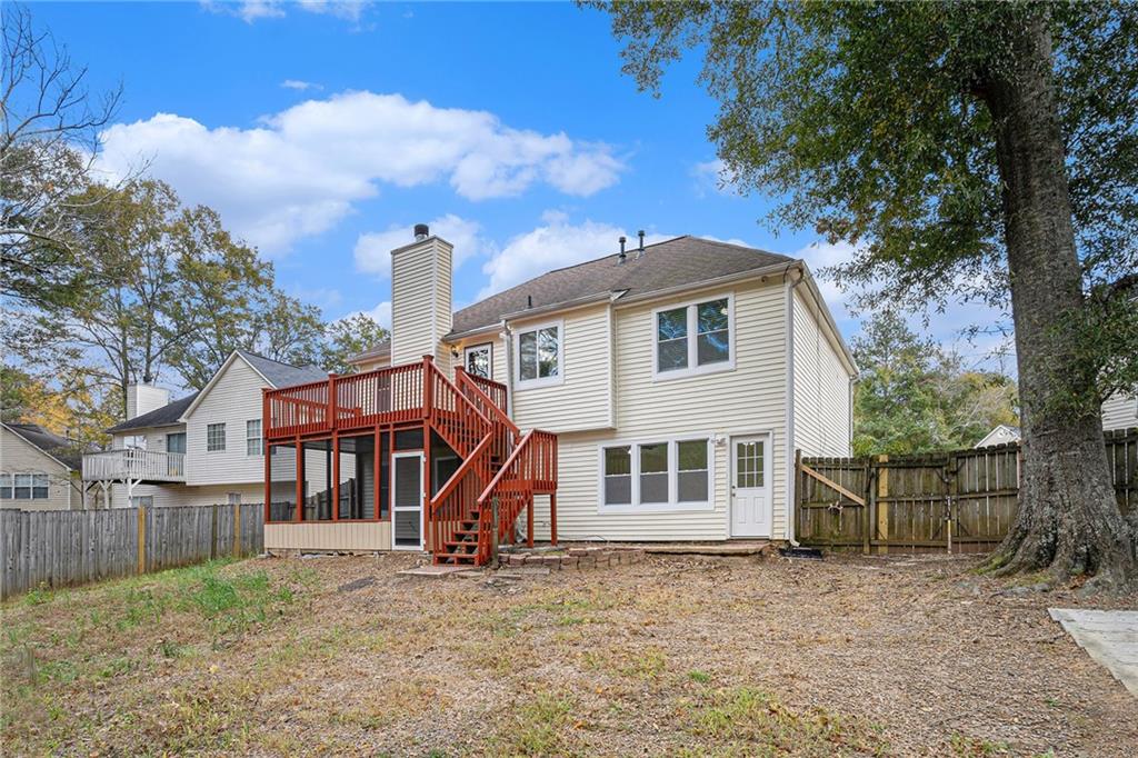 4208 Mistymorn Point Powder Springs, GA 30127 - Photo 28 of 28 a view of a house with a yard and a large tree