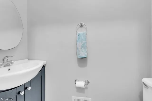 a bathroom with a sink and mirror