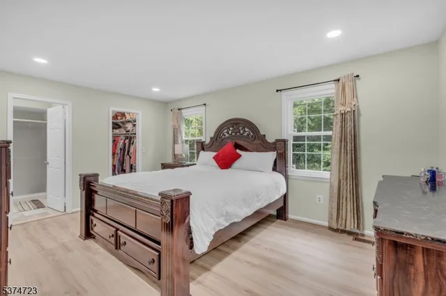 a bed room with a bed and a window