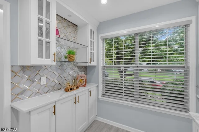 a view of a sink and cabinets