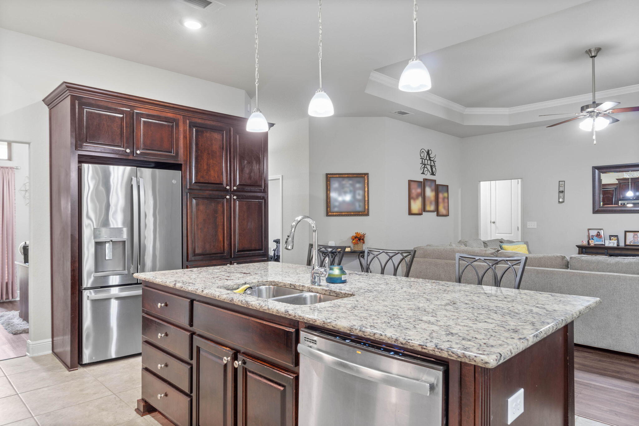 310 Vale Loop Crestview, FL 32536 - Photo 10 of 35 a kitchen with center island and stainless steel appliances