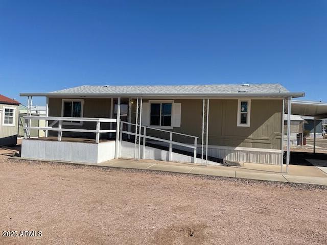 2481 West Broadway Avenue, Unit 71 Apache Junction, AZ 85120 - Photo 1 of 18 a view of a house with a backyard
