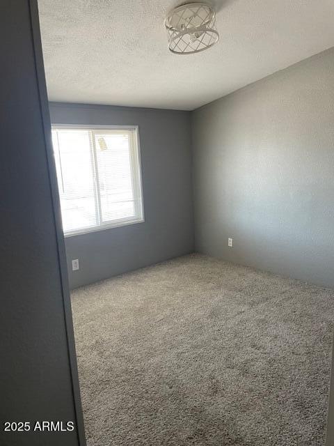 2481 West Broadway Avenue, Unit 71 Apache Junction, AZ 85120 - Photo 11 of 18 an empty room with a window