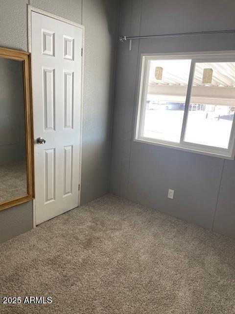 2481 West Broadway Avenue, Unit 71 Apache Junction, AZ 85120 - Photo 16 of 18 an empty room with windows