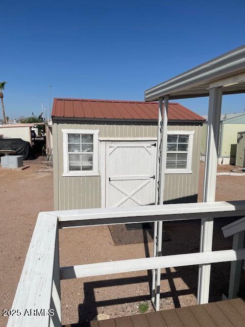 2481 West Broadway Avenue, Unit 71 Apache Junction, AZ 85120 - Photo 4 of 18 a view of a balcony with table and chairs