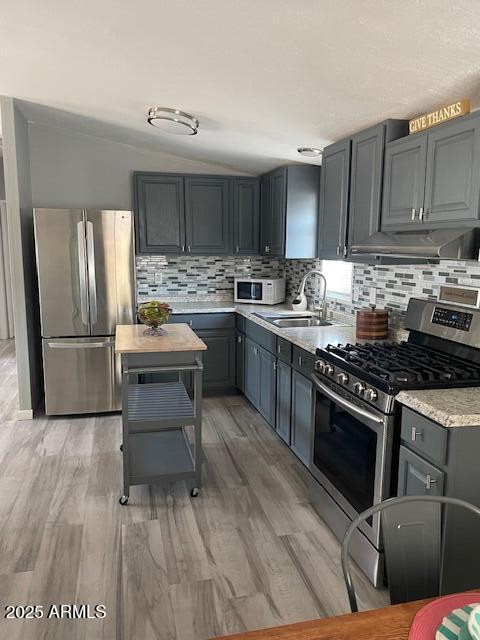 2481 West Broadway Avenue, Unit 71 Apache Junction, AZ 85120 - Photo 5 of 18 a kitchen with kitchen island granite countertop a sink cabinets and stainless steel appliances