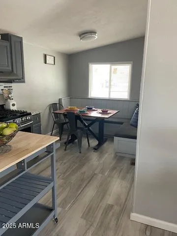 a room with furniture pool table and windows