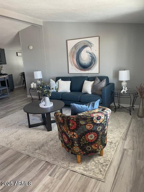 2481 West Broadway Avenue, Unit 71 Apache Junction, AZ 85120 - Photo 8 of 18 a living room with furniture and a painting on the wall