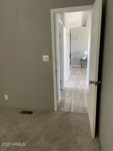 a view of a bathroom from a hallway