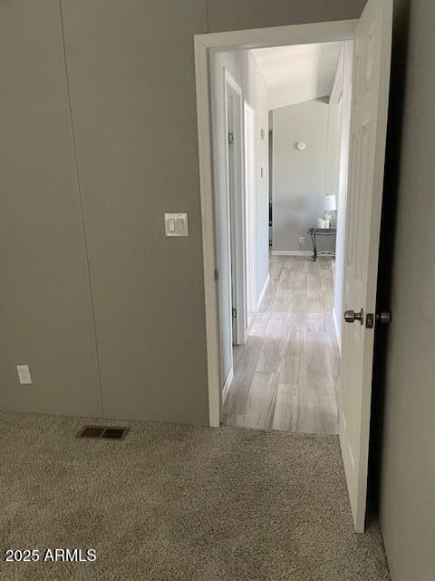 2481 West Broadway Avenue, Unit 71 Apache Junction, AZ 85120 - Photo 9 of 18 a view of a bathroom from a hallway