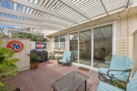 a front view of a house with outdoor seating