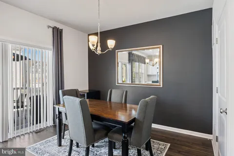 a view of living room with furniture and book shelf