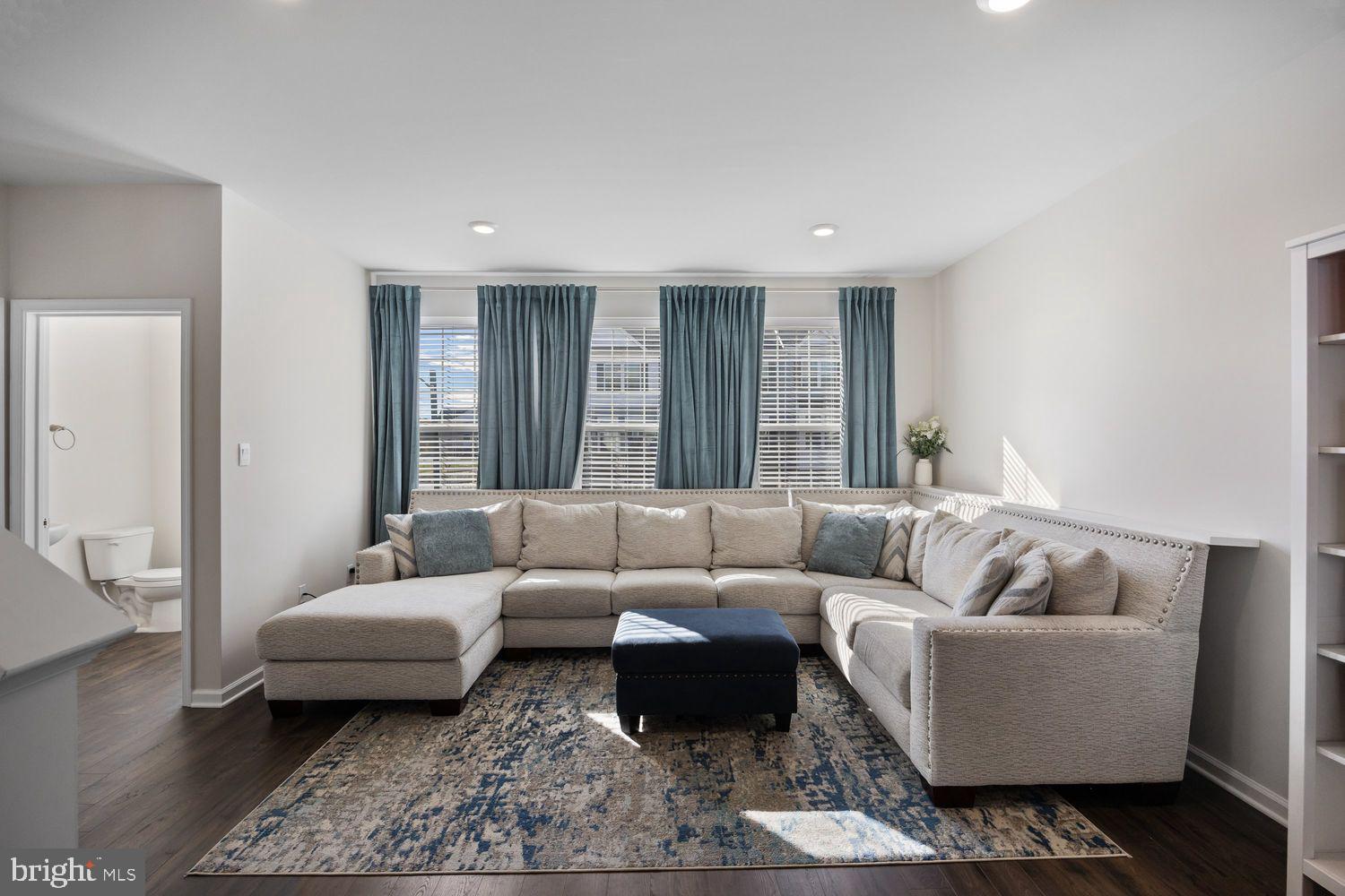 69 Sister's Farmstead Rd Mount Mount Laurel, NJ 08054 - Photo 18 of 44 a living room with furniture and a couch
