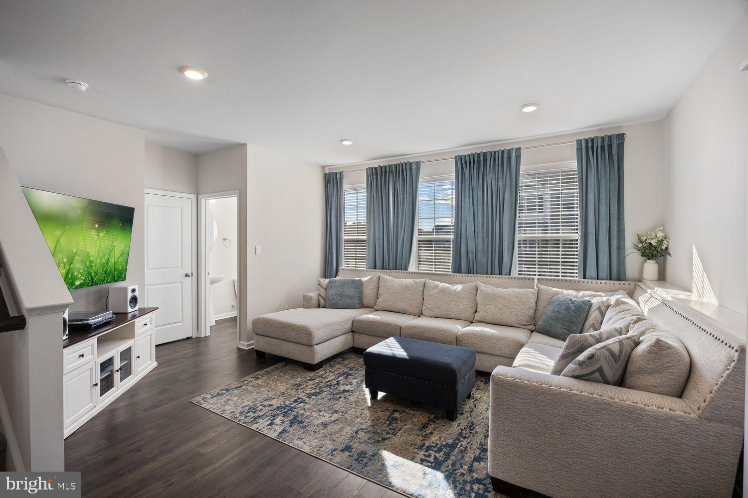 69 Sister's Farmstead Rd Mount Mount Laurel, NJ 08054 - Photo 19 of 44 a living room with furniture and a flat screen tv